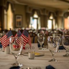 Table setting with little flags in the Emerald Grande ballroom