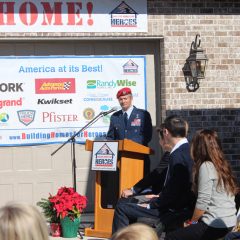 Man wearing uniform speaking at the Nelson Welcome Home event