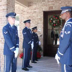 Airmen lining the entrance to the Nelson home